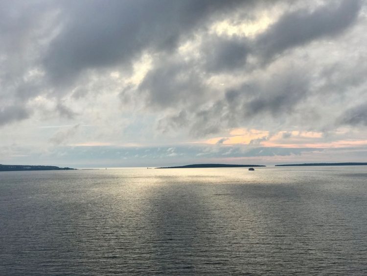 Sun peeking through the clouds over Lake Huron