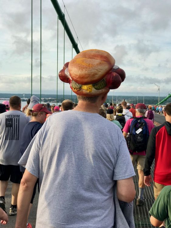 A walker in a hot dog hat. Why not?