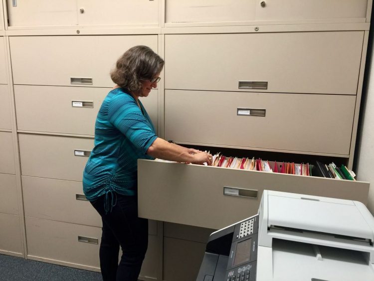 Cheryl filing in CBDRG office