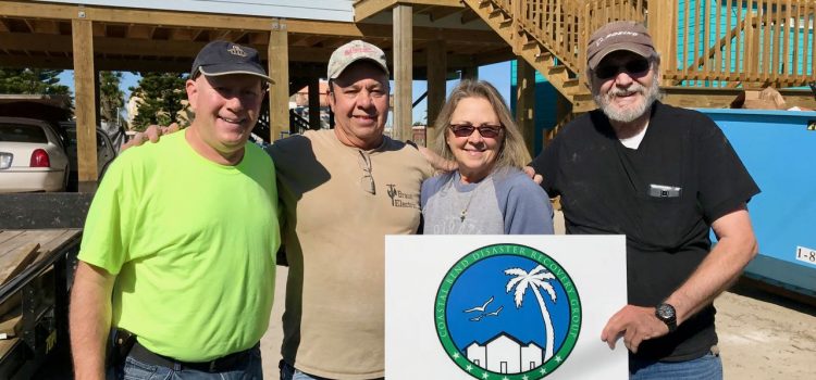 Volunteering with the RV Disaster Corps Our crew celebrating the completion of the floor installation: David, Gene (homeowner), Denise & Les (RVDC volunteers)