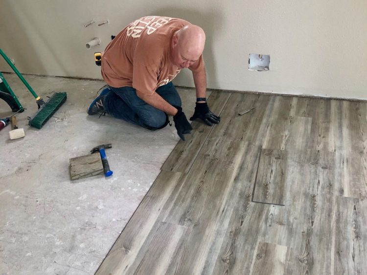 David laying flooring